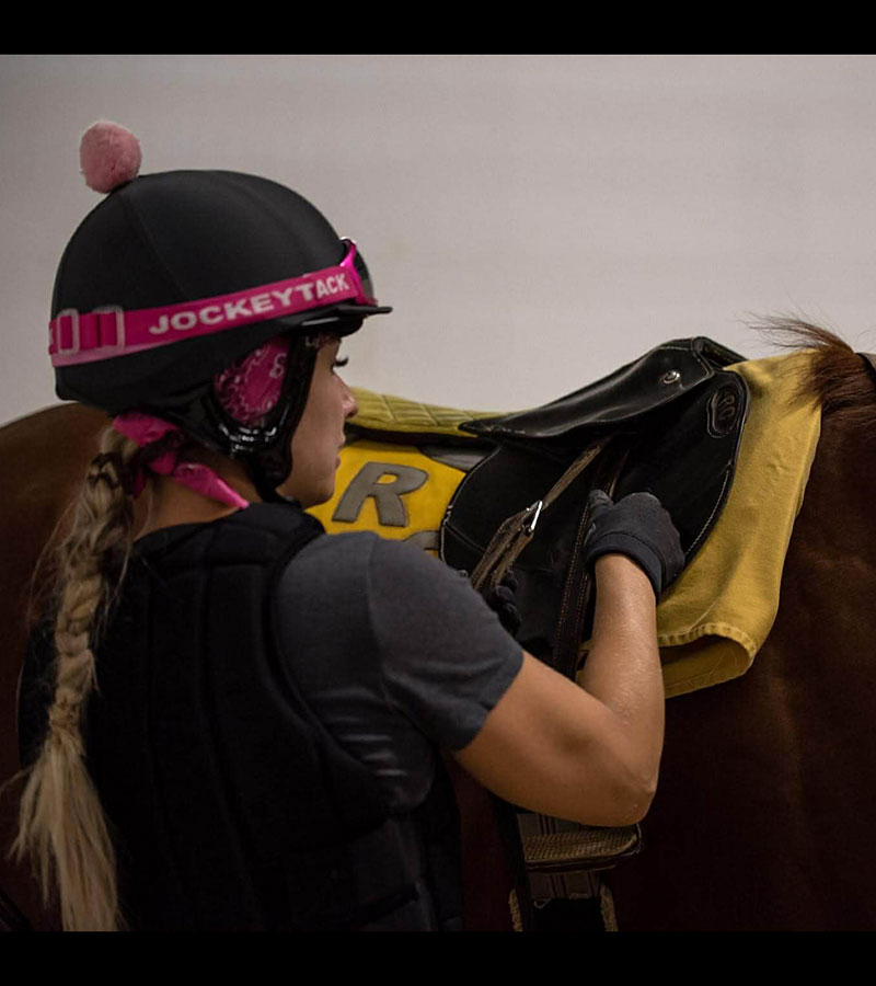 Saddling in the morning at Century Mile 2021