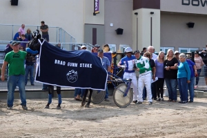 Mike Hennessy and Blue Star Jet in the winner's circle for the Brad Gunn Stake at Century Downs in August 2016