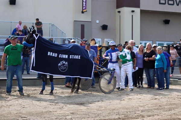 Mike Hennessy and Blue Star Jet in the winner's circle for the Brad Gunn Stake at Century Downs in August 2016