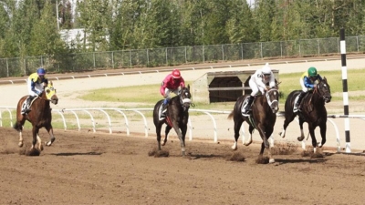 Exactly passing Striders Ring at the wire of Alberta Derby